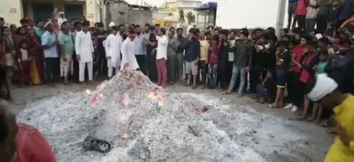 rajasthan  people in kokapur village walk barefoot on fire to celebrate holi