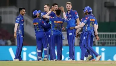 mumbai indians clinch playoffs spot  rcb eliminated