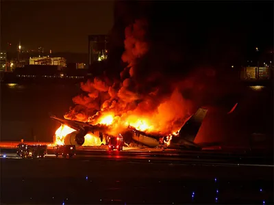 japan airlines aircraft catches fire at haneda airport  all 379 passengers  crew evacuated