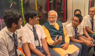 pm modi travels with school students in india s first underwater metro train in kolkata