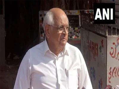 gujarat cm bhupendra patel  his son anuj cast votes in ahmedabad