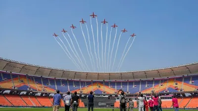 iaf s suryakiran aerobatic team performs air show rehearsal over narendra modi stadium