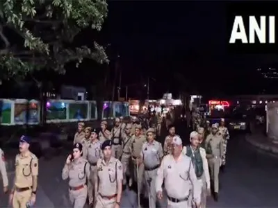 j k police  paramilitary forces hold flag march in reasi ahead of second phase of ls polls