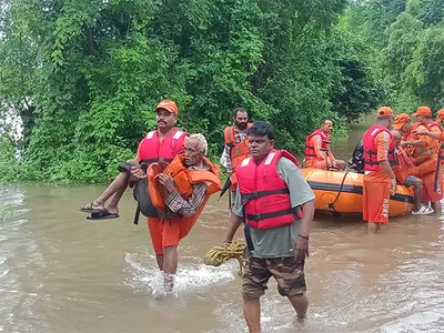 gujarat floods  ndrf rescues senior citizen  4 others from junagadh village