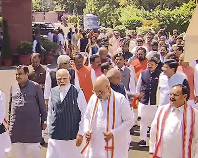 led by pm modi  parliamentarians walk to new parliament building