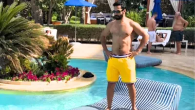 varun dhawan loses balance on pool bed  see hilarious video