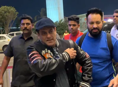 salman khan grabs eyeballs with his funky airport look  wears pants with his face painted on back